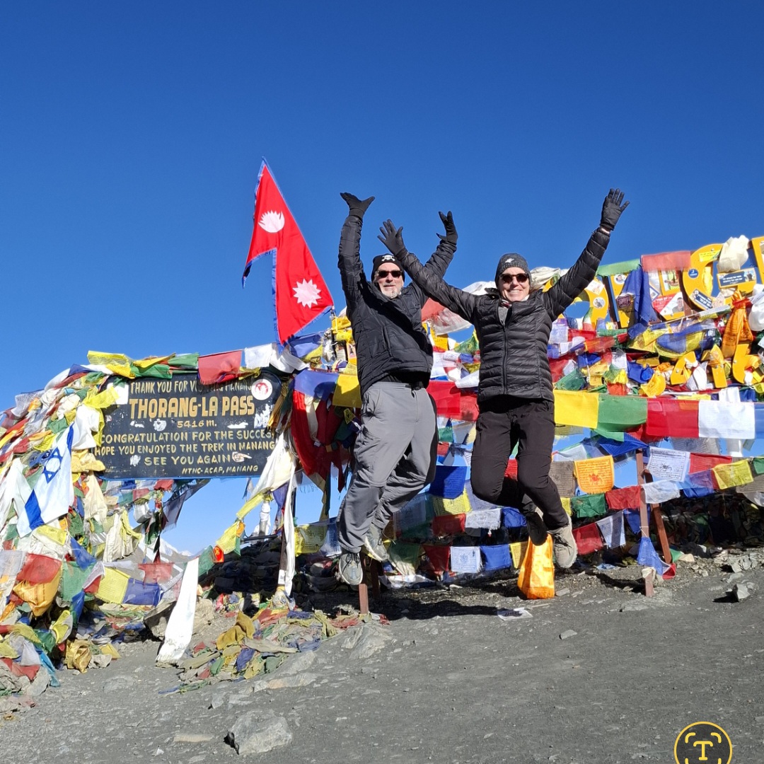 the ArtNomads jump for joy , having reached the Thorong La pass summit.